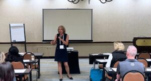 Else Johnson conducting a workshopat the IWCE